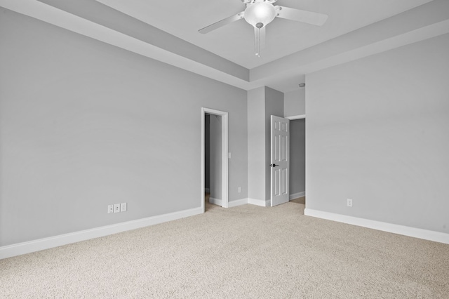 unfurnished room with ceiling fan and light carpet