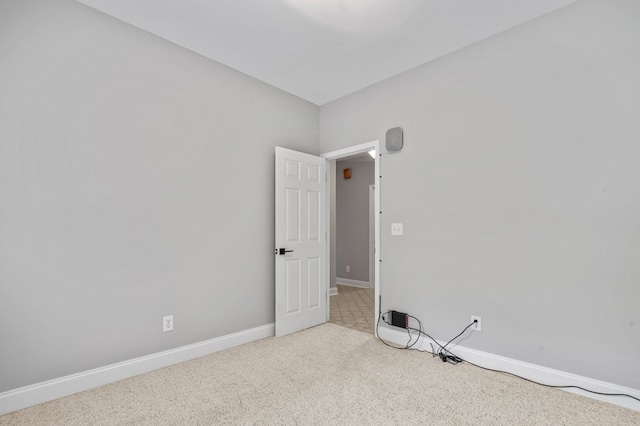 empty room with light colored carpet