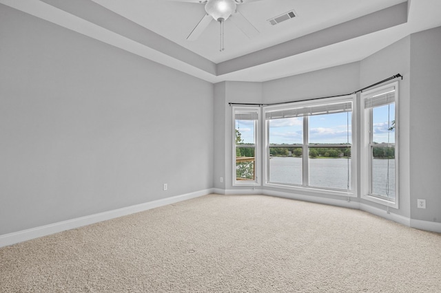 empty room featuring carpet flooring and ceiling fan