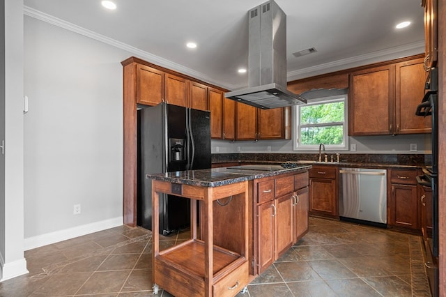 kitchen with island exhaust hood, dark stone counters, a kitchen island, black appliances, and ornamental molding