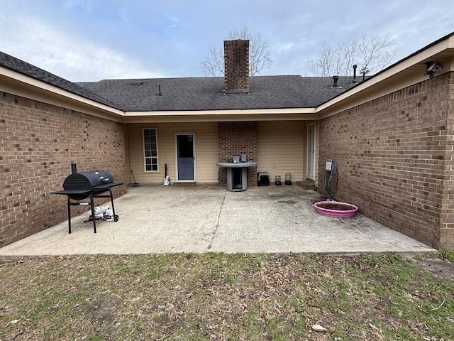 rear view of house with a patio