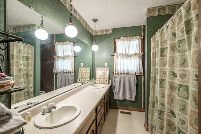 882 Gaissert Church Rd, Sparta, GA 31087 - bathroom with vanity, a textured ceiling, and a shower with shower curtain
