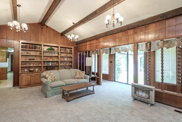 882 Gaissert Church Rd, Sparta, GA 31087 - carpeted living room with vaulted ceiling with beams, a chandelier, wooden walls, and heating unit