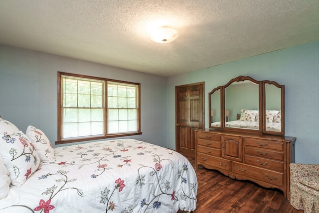 882 Gaissert Church Rd, Sparta, GA 31087 - bedroom with dark wood-type flooring and a textured ceiling