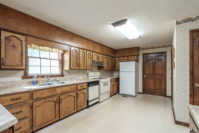 882 Gaissert Church Rd, Sparta, GA 31087 - kitchen with a textured ceiling, white appliances, and sink