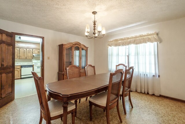 882 Gaissert Church Rd, Sparta, GA 31087 - carpeted dining space with a textured ceiling and an inviting chandelier