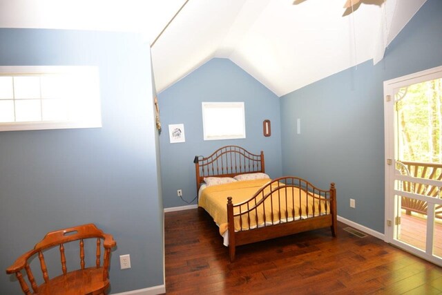 bedroom with hardwood / wood-style floors, multiple windows, vaulted ceiling, and visible vents