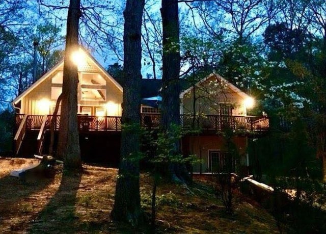 back of property featuring a wooden deck