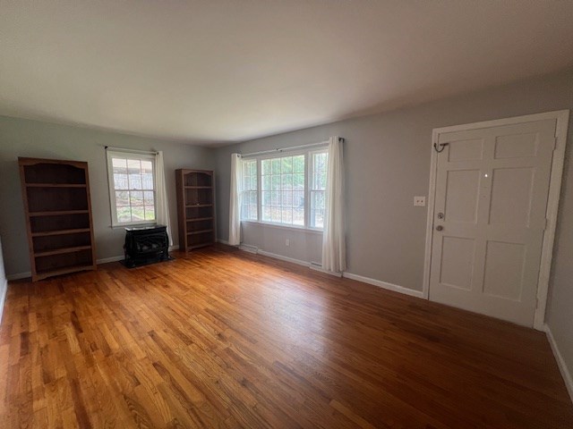 unfurnished living room featuring light hardwood / wood-style flooring