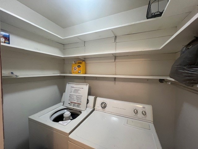 clothes washing area with independent washer and dryer