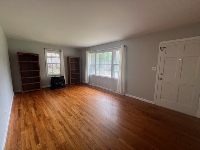 unfurnished living room with hardwood / wood-style floors