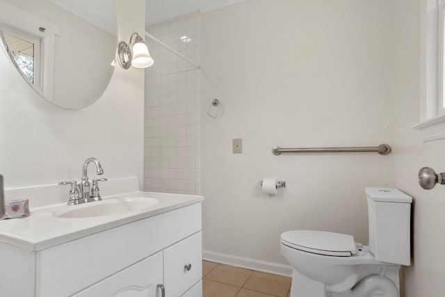 bathroom with tile patterned floors, vanity, and toilet