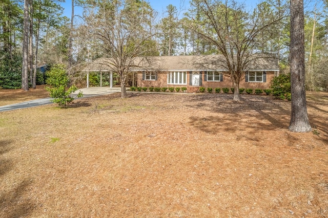 ranch-style house with a carport