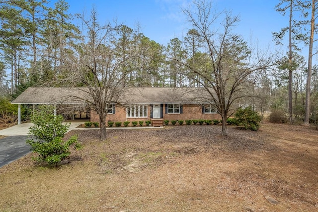 single story home with a carport