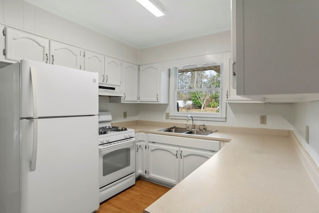 kitchen featuring sink, white appliances, white cabinetry, and light hardwood / wood-style floors