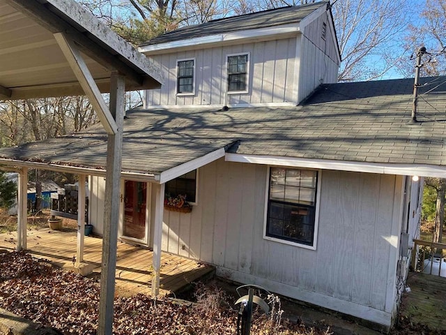 rear view of house with a wooden deck