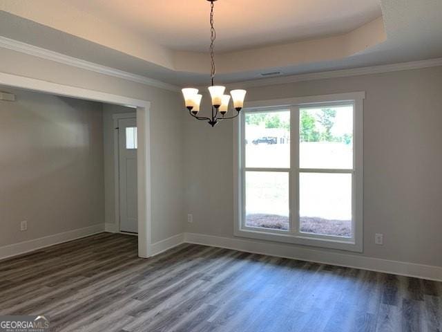 453 Riley Cir, Milledgeville, GA 31061 - spare room with a raised ceiling, dark wood-type flooring, a chandelier, and ornamental molding