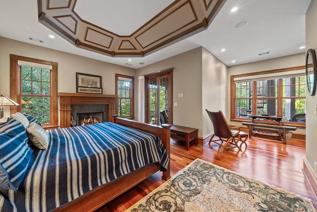 bedroom featuring access to outside and hardwood / wood-style flooring