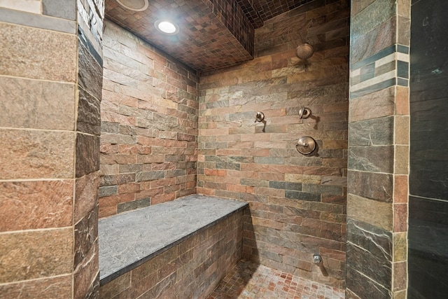 bathroom featuring a tile shower