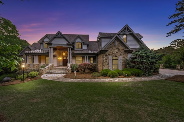 craftsman-style home with a yard and a porch