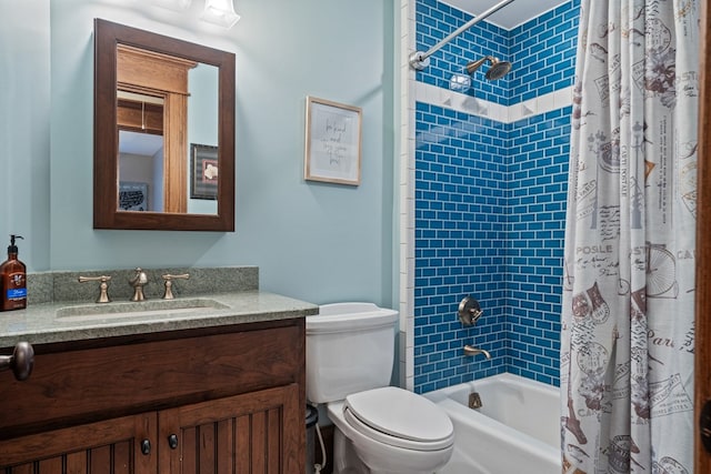 full bathroom with vanity, toilet, and shower / bath combo with shower curtain