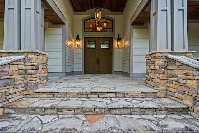 doorway to property with a porch