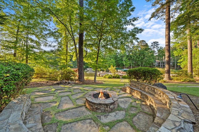 view of patio / terrace featuring an outdoor fire pit