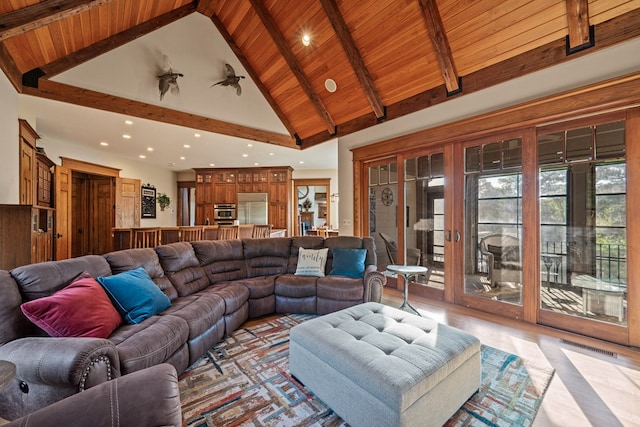 living room featuring beamed ceiling, wood ceiling, and high vaulted ceiling