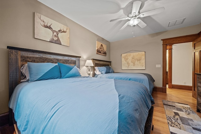 bedroom with ceiling fan and light wood-type flooring