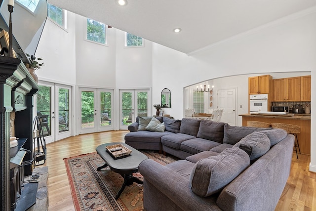 793 Greene Settlement Rd, Gray, GA 31032 - living room with a high ceiling, a chandelier, light wood-style flooring, recessed lighting, and ornamental molding