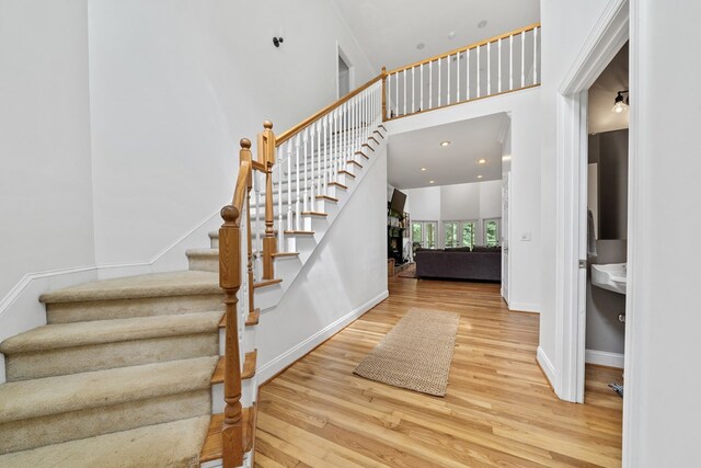 793 Greene Settlement Rd, Gray, GA 31032 - stairway with wood finished floors and a towering ceiling