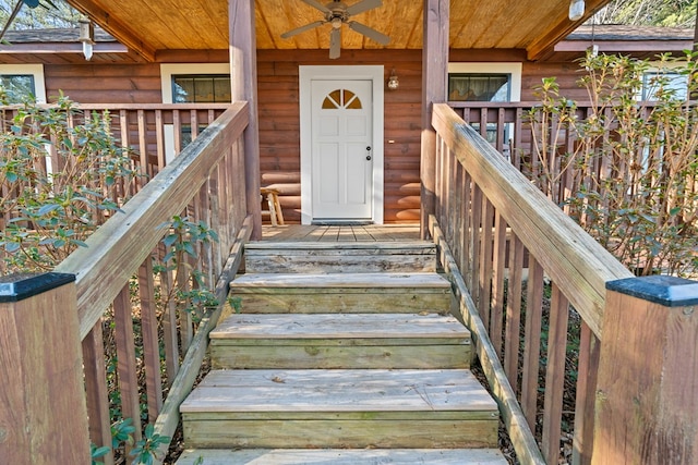 doorway to property with ceiling fan