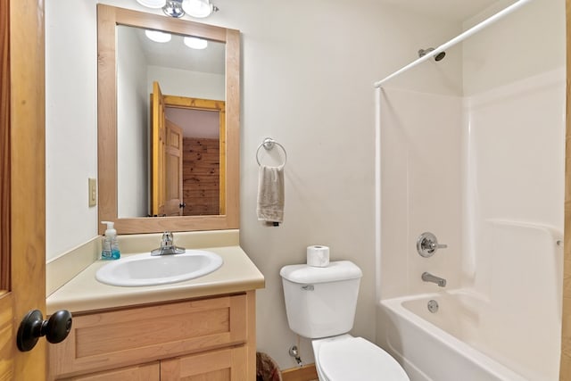 full bathroom with toilet, vanity, and shower / bath combination