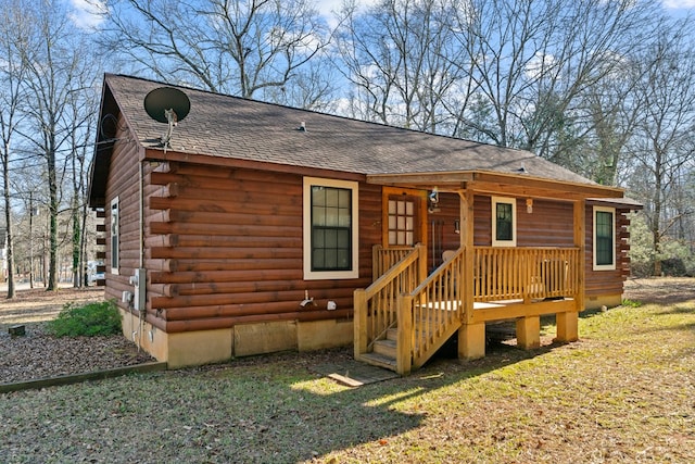 back of house featuring a yard