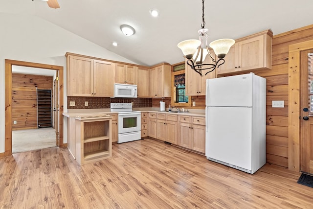 kitchen with vaulted ceiling, pendant lighting, light brown cabinets, and white appliances