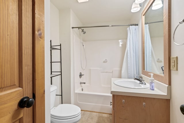 full bathroom featuring toilet, shower / bath combination with curtain, and vanity