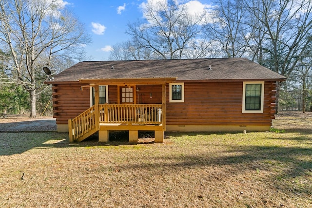 back of house with a lawn