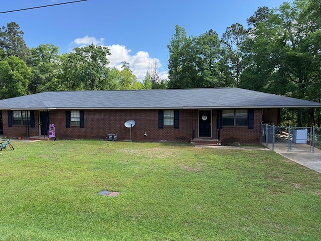 ranch-style house with driveway, an attached carport, a gate, a front lawn, and brick siding