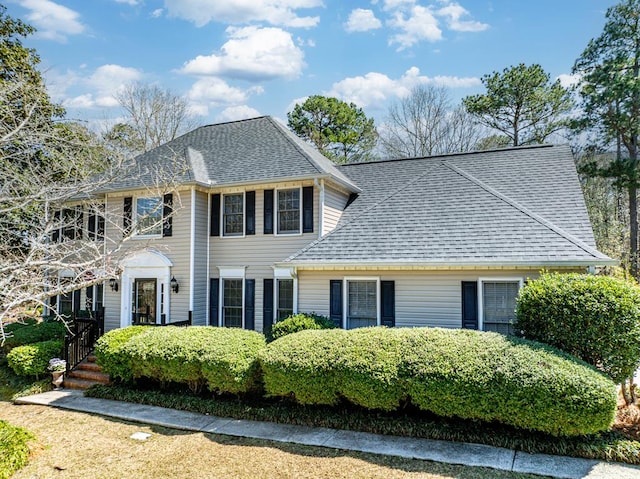 colonial house with a shingled roof