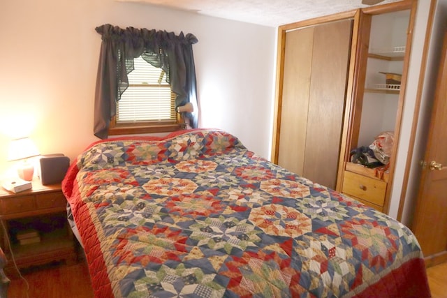 bedroom with wood finished floors