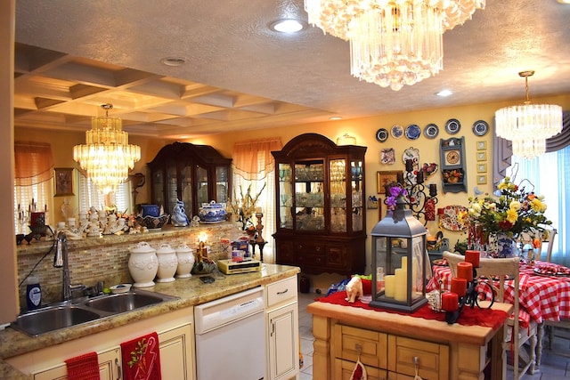 kitchen with an inviting chandelier, dishwasher, sink, coffered ceiling, and a textured ceiling