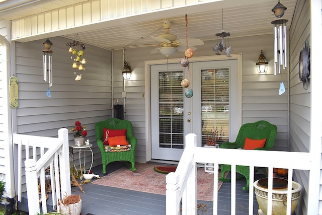 wooden terrace featuring ceiling fan