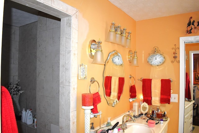 bathroom featuring sink and a textured ceiling