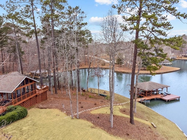 exterior space with a dock and a water view