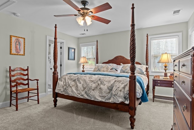 carpeted bedroom featuring multiple windows and ceiling fan