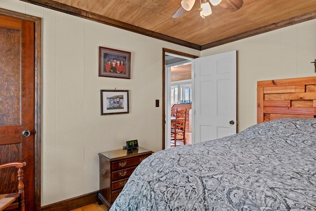 bedroom with wood ceiling, ceiling fan, and ornamental molding