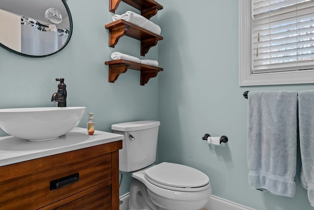 bathroom with vanity and toilet