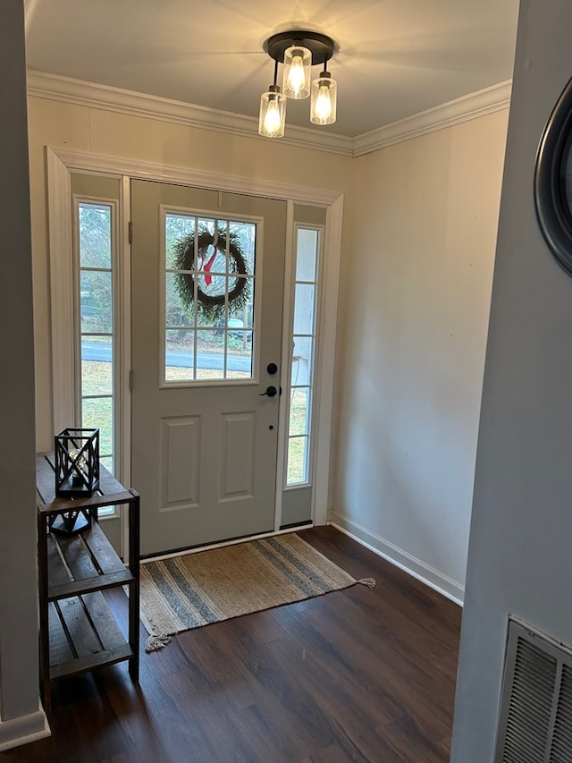 entryway featuring dark hardwood / wood-style floors and crown molding