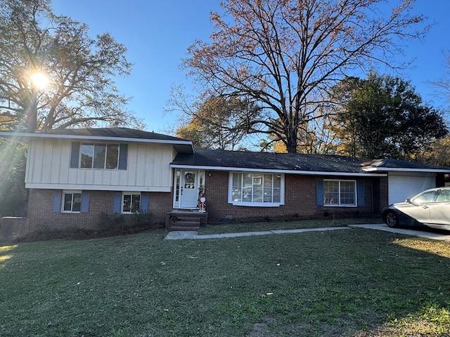 view of front facade with a front yard and a garage