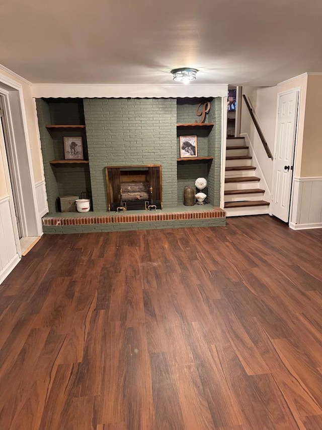 unfurnished living room with a fireplace and hardwood / wood-style floors